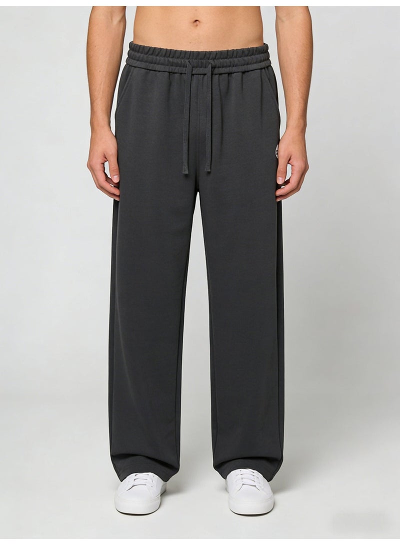 Alo Yoga Ultra-Soft High-Waisted Wide-Leg Track Pants in Charcoal - Image 1